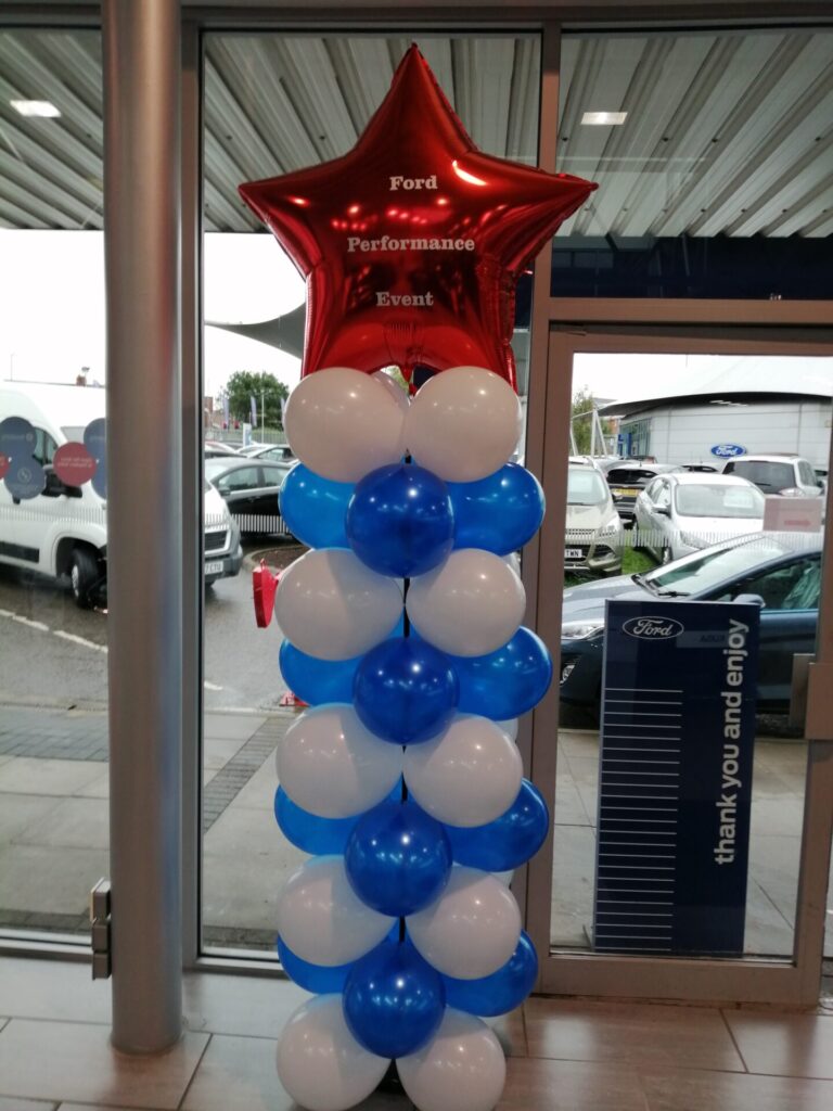 Blue and white balloon pillar with red star foil balloon