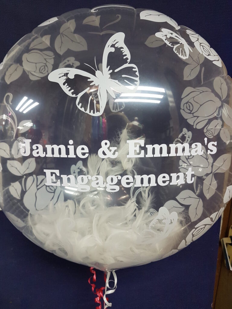 Engagement bubble balloon with white feathers