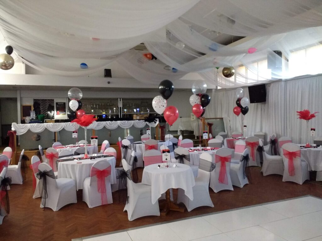 Black white and red clusters of 3 balloons